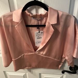 New with tags Zara light pink blouse. Size small.